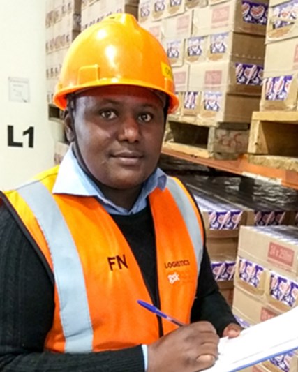 Francis Nono, employee, in warehouse, Kenya  