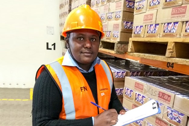 Francis Nono, employee, in warehouse, Kenya