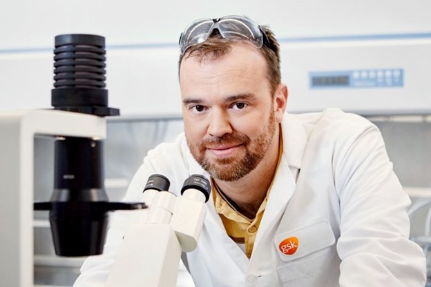 GSK employee with microscope